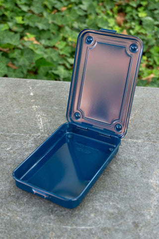 Navy trunk-shape metal toolbox with open lid showing empty interior