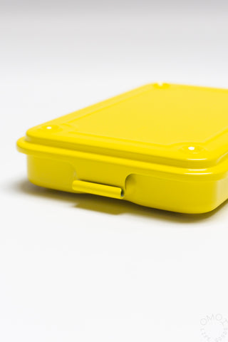 Yellow trunk-shaped toolbox, closed with side latch