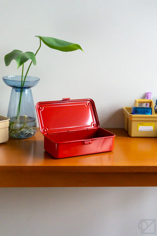 Red stackable storage box with lid open and hinged base