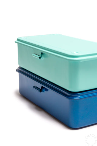 Stacked teal plastic storage boxes with handle cutouts, side view