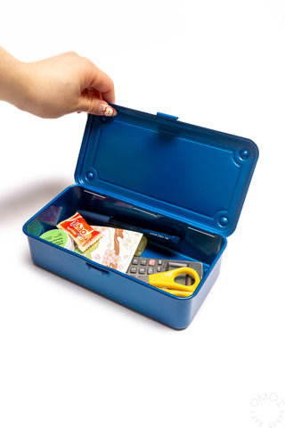 Blue stackable storage box open with organizer contents and yellow scissors