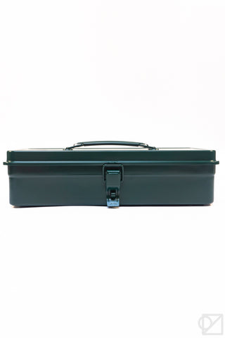 Antique green trunk-shaped metal toolbox closed with carry handle and central latch