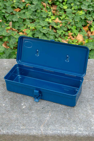 Navy trunk-style toolbox open, showing interior tray and latch
