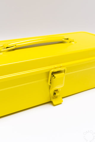 Yellow trunk-shape toolbox side latch close-up