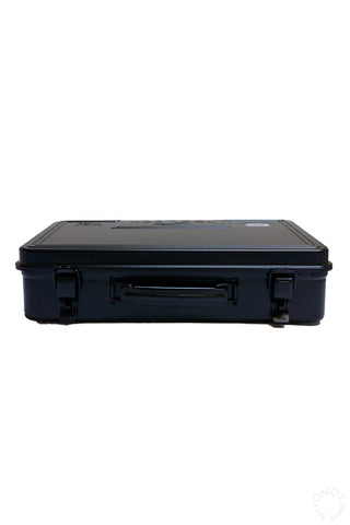 Black trunk-shaped toolbox with side latch and molded handle, lid closed
