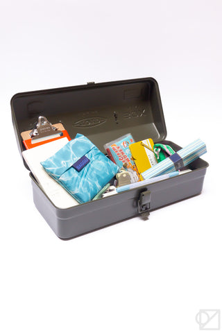 Olive green toolbox open with organizer tray and stationery supplies inside