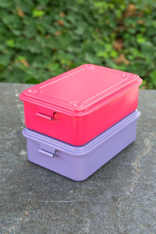 Stacked trunk-shaped toolbox set with pink and lilac hinged lids