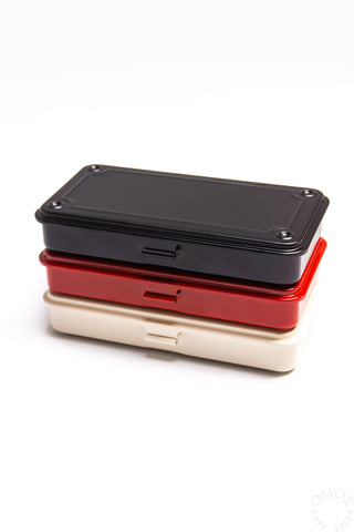 Stacked trunk toolbox cases in black, red, and white with latch tab