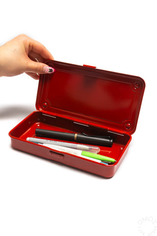 Red trunk toolbox case open, showing tools and interior lining