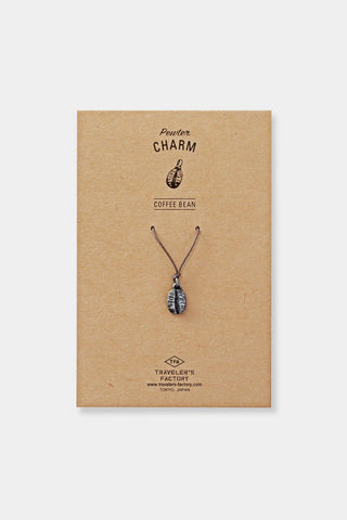 Pewter coffee bean charm on display card, with cord loop at the top