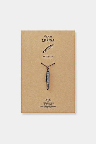 Pewter charm pen display card labeled 'Pewter CHARM' and 'TRAVELER'S FACTORY'