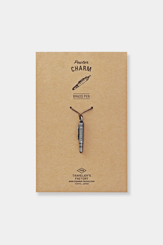Pewter charm pen display card labeled 'Pewter CHARM' and 'TRAVELER'S FACTORY'