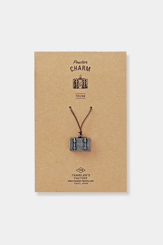 Pewter trunk charm on cord, shown on Traveler's Factory card