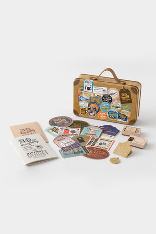 Traveler's notebook 20th anniversary customization set with mini guide and metal pieces