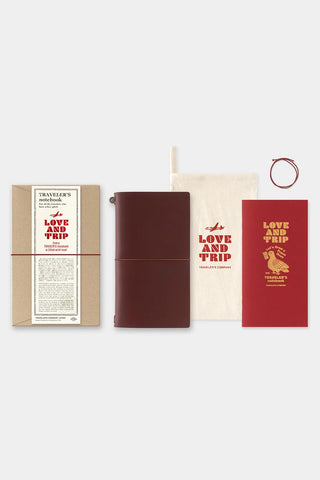 Red leather journal cover with printed notebook set in a starter kit