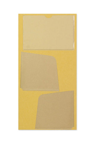 Traveler's notebook pocket sticker sheet with three blank beige label pieces