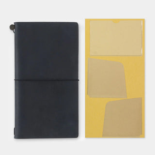 Traveler's notebook pocket stickers sheet shown with black notebook cover