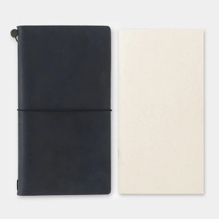 Traveler's sketch notebooks with black and cream covers, each closed with a band