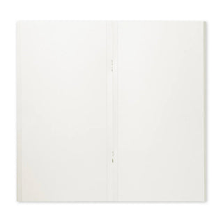 Open sketch paper notebook showing two blank inner pages