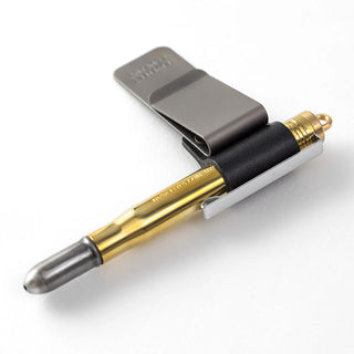 Traveler's notebook pen holder with black leather and gold pen in slot