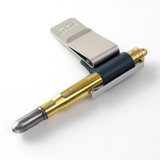 Traveler's notebook pen holder with blue leather and gold pen in slot