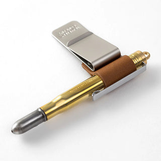 Traveler's notebook pen holder with brown leather and a gold pen in holder