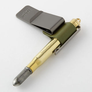 Traveler's notebook pen holder with olive-green cover and gold pen in holder