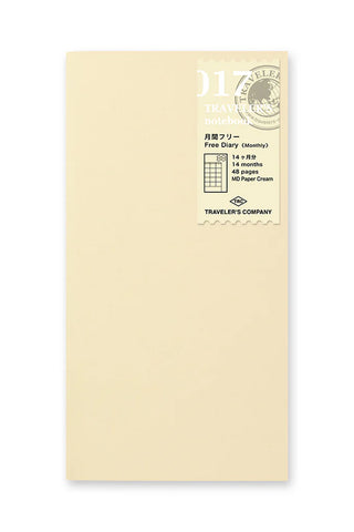 Beige notebook cover with round seal and monthly planning label