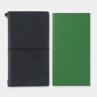 Two notebooks side by side: dark elastic-bound cover and green elastic-bound cover