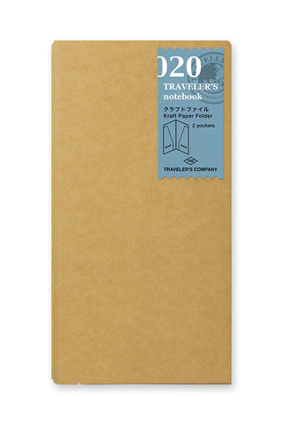 Kraft paper notebook folder with label card showing "020" and "Travelers notebook"