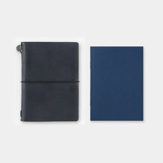 Two passport-size notebooks: dark blue lined book and black cover with wrap cord