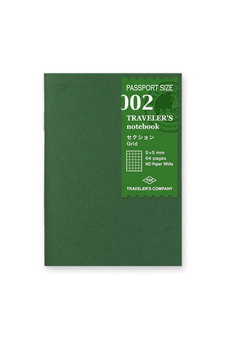Green passport-size 002 grid notebook cover with label