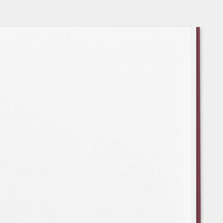 Burgundy notebook with slim spine edge, closed blank cover