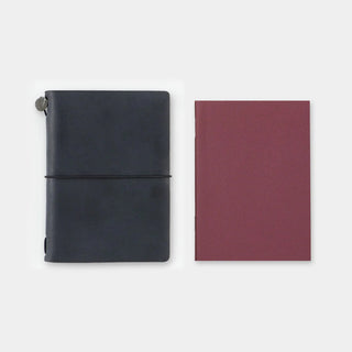 Two passport-size blank notebooks: navy with strap and burgundy cover