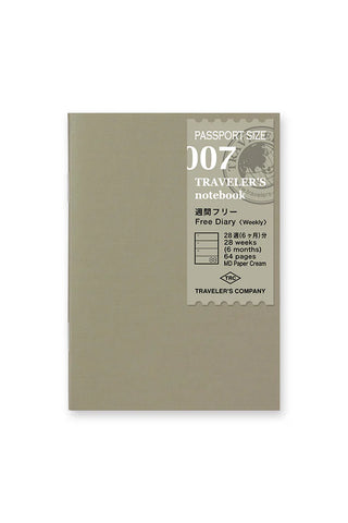 Passport-size weekly planner notebook, olive cover with TRAVELER'S label