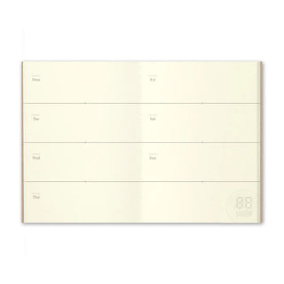 Open weekly planner spread with blank grid and day labels