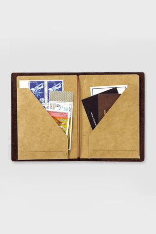Open kraft paper passport folder with two document pockets, brown inserts