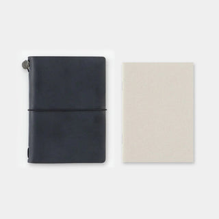 Passport-size notebooks in navy and beige with elastic band
