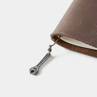 Pewter adjustable wrench charm dangling from cord, small metal keychain