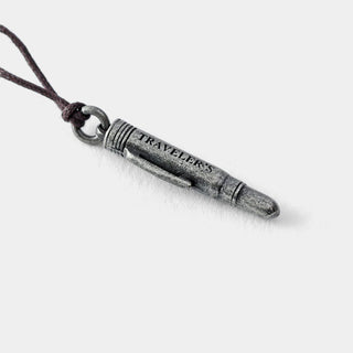 Pewter pen charm on dark cord, with 'TRAVELER'S' stamped on the barrel