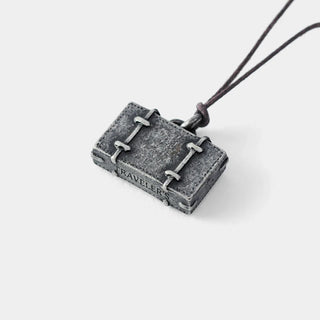 Pewter trunk charm with buckle details and hanging cord