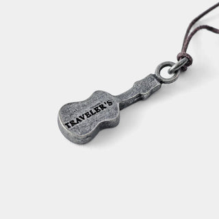 Pewter ukulele charm stamped "TRAVELER'S"
