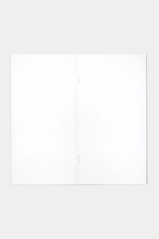 Open short trip notebook with two blank white pages