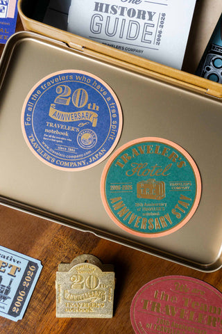 Traveler's notebook 20th anniversary customization set: gold tin with 20th seals and tags