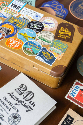 Traveler's notebook 20th anniversary set stickers on a kraft case lid