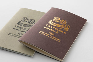 Two Traveler's notebook covers for 20th anniversary with gold logo