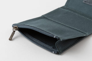 Blue card holder wallet open, showing zipper pocket and fabric lining