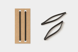 Black elastic straps and kraft insert for card-size notebook set.