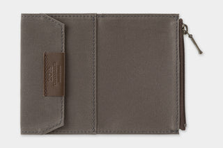 Card-size notebook interior with slip pocket and fabric lining, shown open