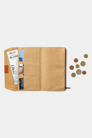 Beige cotton zipper case partially open with inside pockets and zipper pull